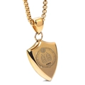 Macro detail of gold shield pendant featuring laser engraved Gemini zodiac and sun motif - Gemini / Gold