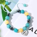 Adjustable beaded heart bracelet with blue, yellow and grey stones on white background - Happy-Age 2