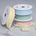 Macro detail of macaron colored lace ribbons with floral embroidery on white spools - Multi-color Combo (Contact Support)