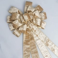 Champagne velvet Christmas bow with gold wire edges on white marble background - Champagne