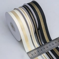 Detail of metallic gold striped grosgrain ribbon rolls in various widths on ruler - Stamping and Printing Style