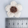 Handmade crochet puff flower in cream and brown yarn shown with measurement ruler - Beige + Coffee Heart