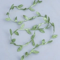 Close-up of artificial green leaf vine ribbon with realistic vein texture for DIY crafts - Green Marijuana Leaf