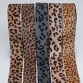 Macro detail of various leopard print ribbons in five shades for DIY bow hair accessories - Custom Colors