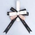 Detail of multi-layered bow with Best Wishes text and metallic gold edge ribbons - Multi-layer Finished Bow