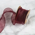 6cm burgundy fishtail chiffon ribbon with wavy edges on brown cardboard spool - 6cmx9m / Burgundy