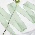 Sheer light green chiffon silk ribbon draped over white roses for wedding decor - 4cm Wide
