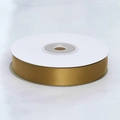Close-up of golden satin polyester ribbon roll on white spool for gift packaging - Gold