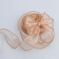 Elegant champagne gold organza ribbon with woven edges tied in a large decorative bow - Coffee / 6cm x 9m