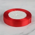Vibrant red satin ribbon roll on marble surface for wedding decoration - 2cm x 22m