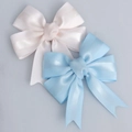 Light pink and blue grosgrain ribbon bows with ribbed texture for gift wrapping - Bow Knot Style