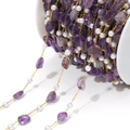 Golden chain necklace with irregular natural amethyst stones and white pearls on a spool - Purple