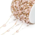 Golden stainless steel chain with irregular pink quartz stones and pearls on a white spool - Water Pink