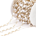 Golden stainless steel DIY chain with white enamel heart charms on a spool roll - White