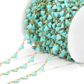 Golden stainless steel 6mm heart chain with turquoise enamel on a white plastic spool - Blue