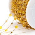 DIY jewelry chain with faceted yellow crystal beads and gold metal beads on spool - Lemon Yellow