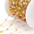 Colorful crystal beads on gold-plated stainless steel chain wound on a white spool - Mixed Yellow Red