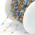 Gold stainless steel DIY bead chain with colorful glass crystals on a white spool - Mixed Blue