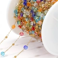 Colorful crystal bead chain with gold spacer beads on white spool for DIY jewelry making - Multicolor