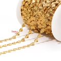 Golden 7mm heart-shaped link chain on a white spool for DIY jewelry making - Embossed Heart Chain (7mm) / Gold