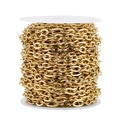 Detailed macro view of 7mm gold stainless steel flat oval link chain on a white spool - 7MM Wide * 1 Meter / Gold