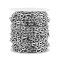 Macro shot of 7mm stainless steel oval flat link chain on white plastic spool - 7MM Wide * 1 Meter / Steel