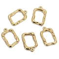 Detail of five gold textured irregular rectangular charms with hammered finish for DIY jewelry - Gold