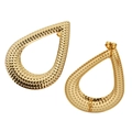 Close-up of golden teardrop earring studs with textured dot pattern and steel pin - Dot Waterdrop Gold