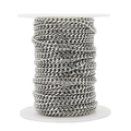 Macro detail of 5.5mm silver stainless steel curb chain tightly wound on white spool - Steel Color Wide Six-Sided Polished Chain