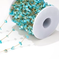 Detail of 1mm gold chain roll with sky blue natural crushed stones for DIY jewelry - 1mm Gold Chain / Peacock Blue Shell Link