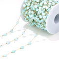 Detail view of 6mm light blue heart shell beads on a gold chain for DIY jewelry - 1mm Chain 2mm Bead And 6mm Heart / Light Blue Heart Shell
