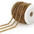 Golden rhinestone claw chain with champagne crystals on a white spool for DIY jewelry - 3mm / Light Brown