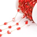 Macro detail of 4mm irregular red shell beads with gold chain for DIY jewelry making - 4-7mm Irregular Red Shell Chain