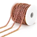 Pink rhinestone claw chain with gold metal base on a spool for DIY jewelry and crafts - 3mm / Pink