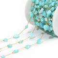 Close-up of 4mm irregular blue shell beads DIY jewelry chain with golden spacers on a spool - 4-7mm Irregular Blue Shell Chain