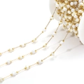 Golden DIY bead chain featuring white shell beads and small metal spheres for jewelry - Round Bead And Disk (F2278)