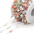 DIY necklace chain with colorful star-shaped shell beads on a white plastic spool - 9mm Star Colorful Shell 0.8 Silver Chain
