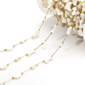 Golden bead chain with white moon-shaped shell beads on a white plastic spool - Round Bead And Moon (F2278)