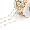 Golden stainless steel chain with white droplet pearls and beads on a spool - Round Bead And Water Drop (F2278)