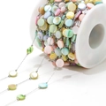 Colorful shell bead chain in pastel macaron tones on a white plastic spool for DIY jewelry - 8mm Round Disc Colorful Shell 0.8 Silver Chain