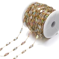 Golden bead chain with faceted AB crystal glass charms for DIY jewelry making on a white spool - Colorful