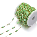 Green rhombic glass crystal bead chain with gold connectors on white plastic spool - Grass Green