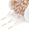 Pale pink oval crystal beads with gold chain on white spool for DIY jewelry making - Light Pink