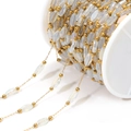 Golden chain with translucent white diamond glass crystal beads on a plastic spool - Transparent Iridescent White