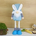 Pink and blue Easter gnome doll with bunny ears on a decorative rustic wood background - Bearded Doll / Blue Male Style