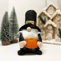 Gnome figurine holding an orange pumpkin for Thanksgiving and harvest home decoration - Top Hat Style