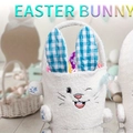 White plush Easter bunny basket with blue checkered ears and colorful decorative eggs - Blue Ear Rabbit