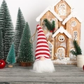 Knitted Christmas gnome ornament with striped hat and white beard hanging on tree - Striped Gnome