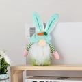 Detail of Easter gnome plush with bunny ears, carrot accents, and soft white beard decor - Emerald Green