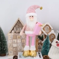 Detailed view of pink and gold Christmas gnome with sequined hat and gift bag accessory - Santa Claus